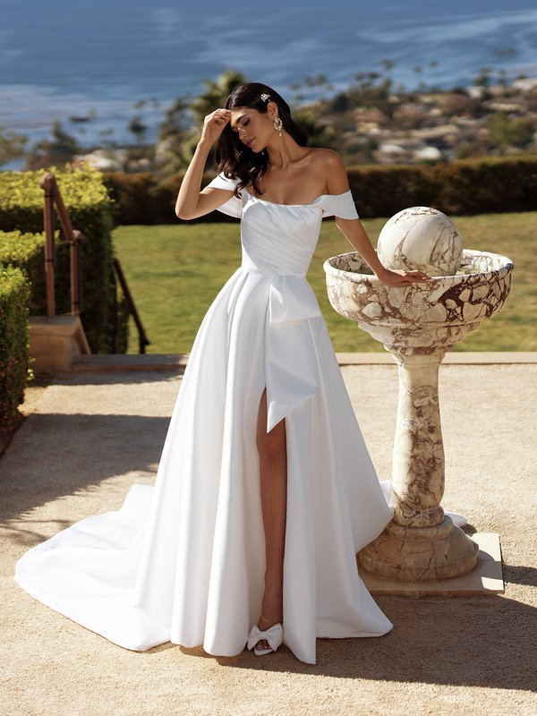 Bride Wearing Moonlight Couture H1581 Stretch Mikado A-Line with Front Leg Slit and Swag Sleeves