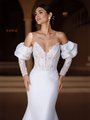 Bride in Luxurious Mikado wedding dress Moonlight Couture H1589 also features an illusion bodice, sweetheart neckline, and puff illusion sleeves