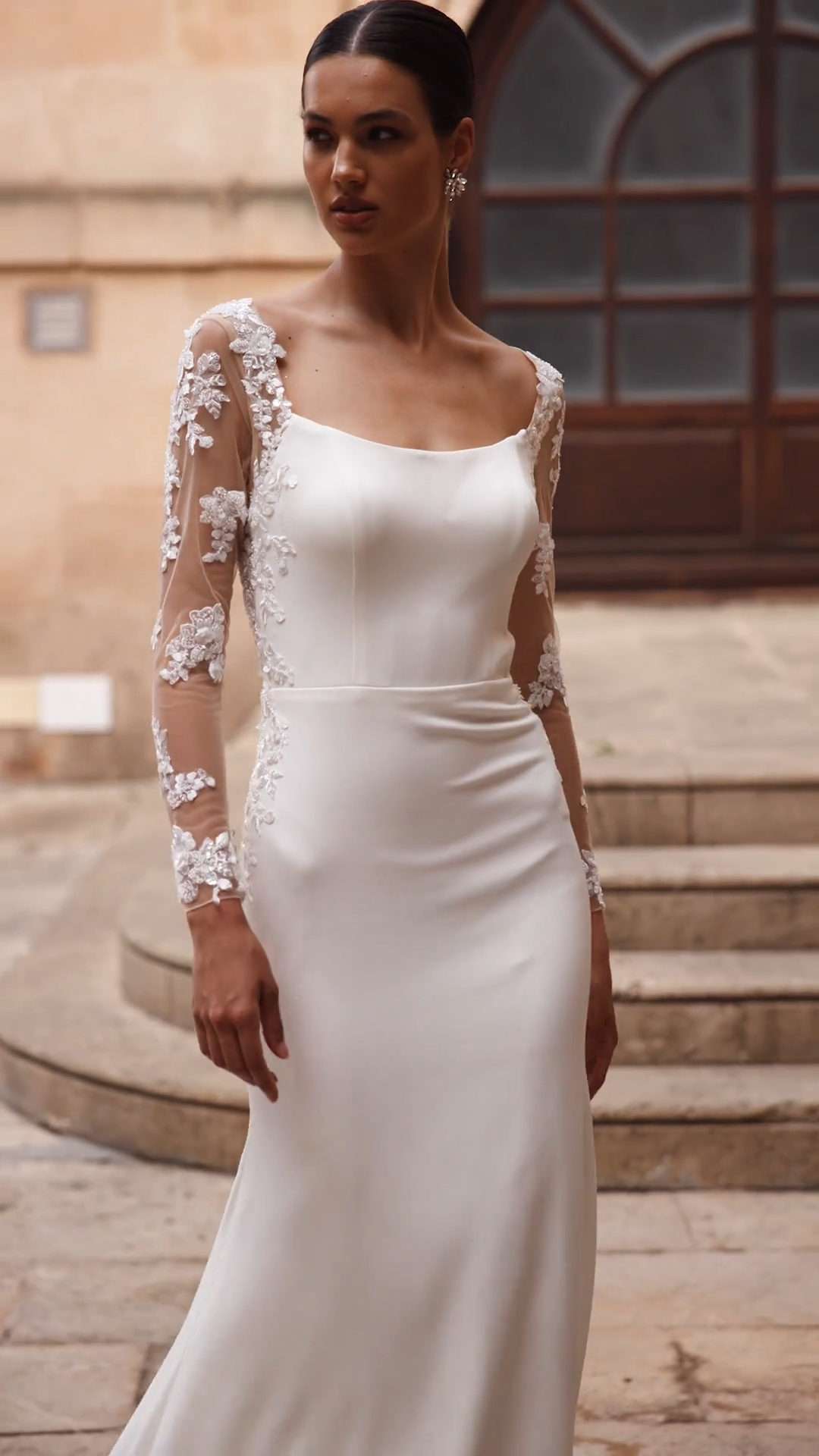 Illusion long sleeve crepe wedding dress with scoop neckline and lace cutout sweep train