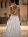 Illusion back wedding dress with tattoo lace and buttons along the the back to the end of the train
