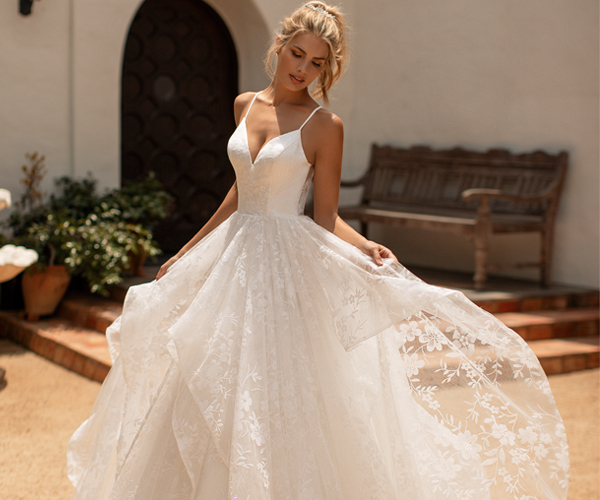 Wedding dress featuring floral sparkle tulle and spaghetti straps