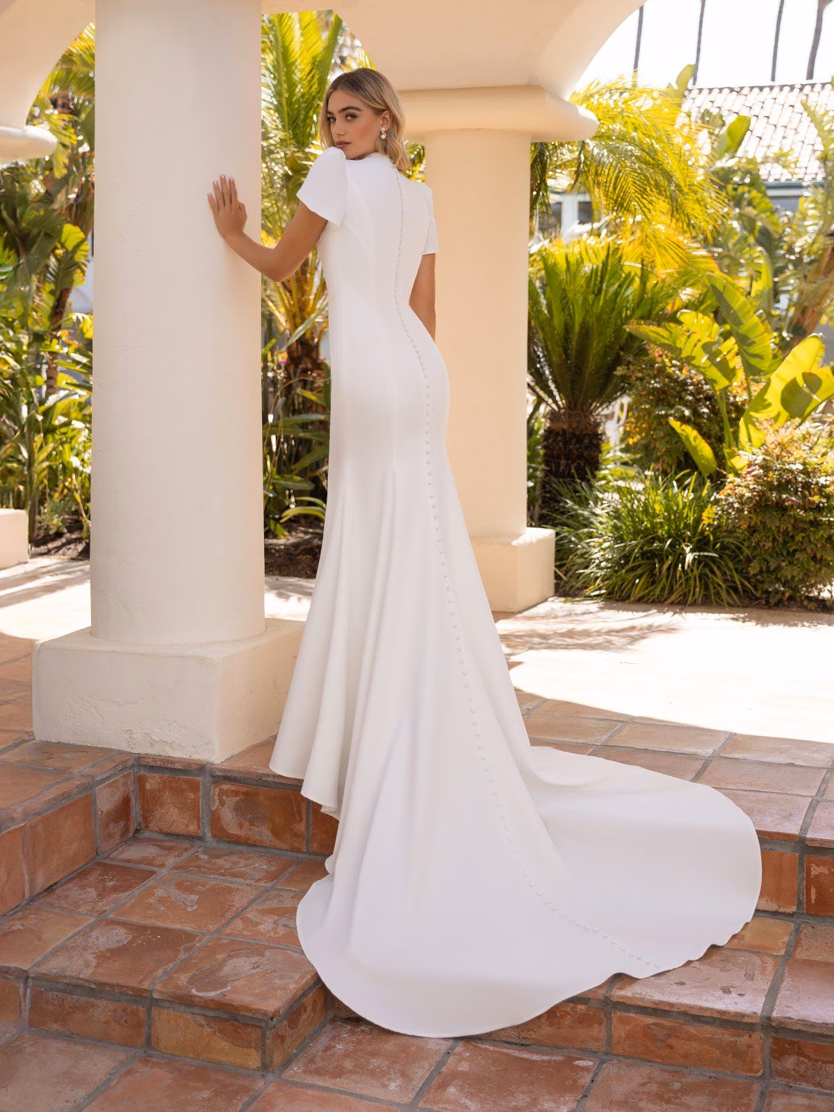 Style M5102 Temple ready mock high back crepe mermaid with buttons to end of sweep train