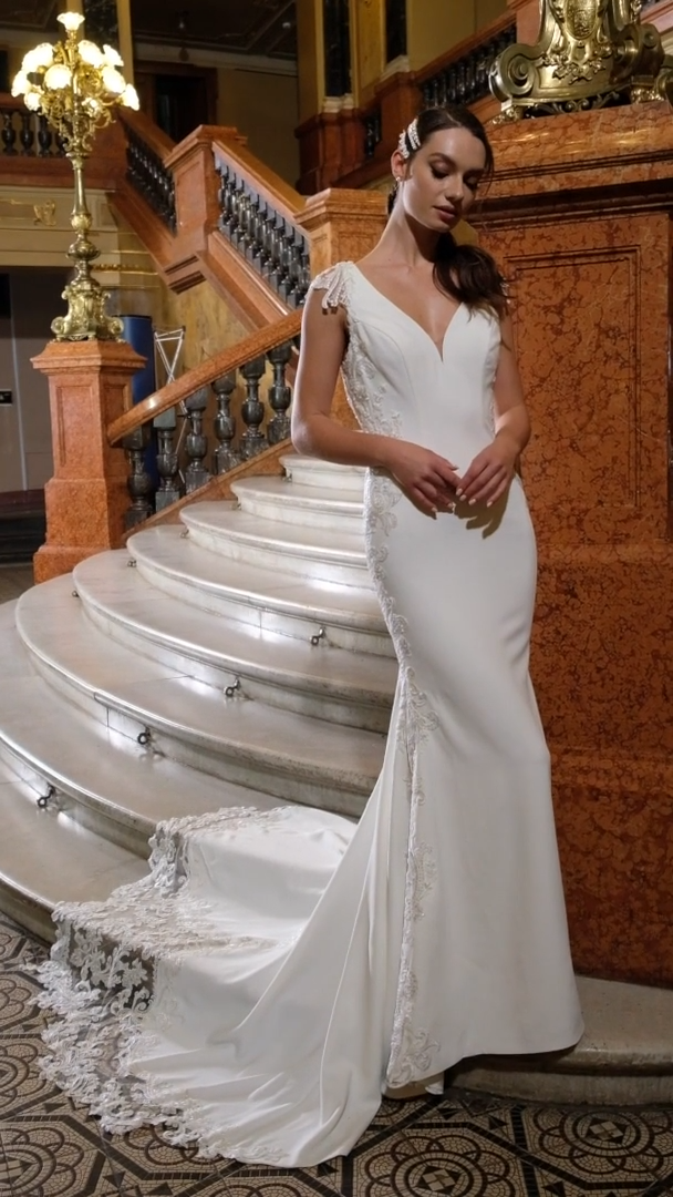 Moonlight Couture H1473 Lace Cap Sleeve Ivory Crepe Mermaid Wedding Dress With Silver Corded Lace Appliques Along the Side and Cut Out Train Moonlight Couture H1473 Lace Cap Sleeve Ivory Crepe Mermaid Wedding Dress With Silver Corded Lace Appliques Along the Side and Cut Out Train