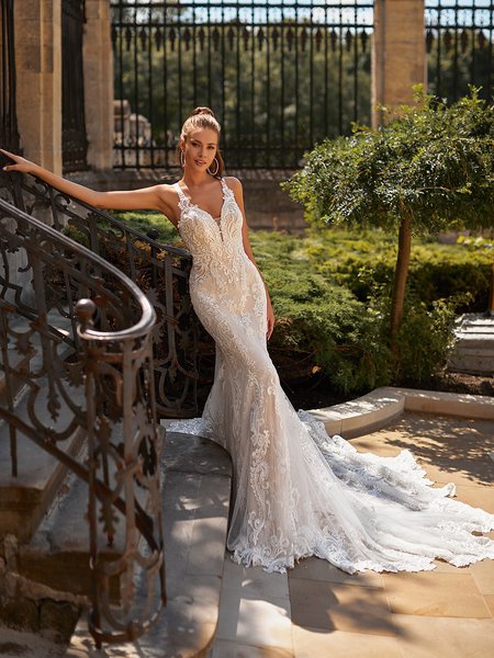 Moonlight Couture H1489 romantic lace wedding dresses with sleeves and beading make a statement.