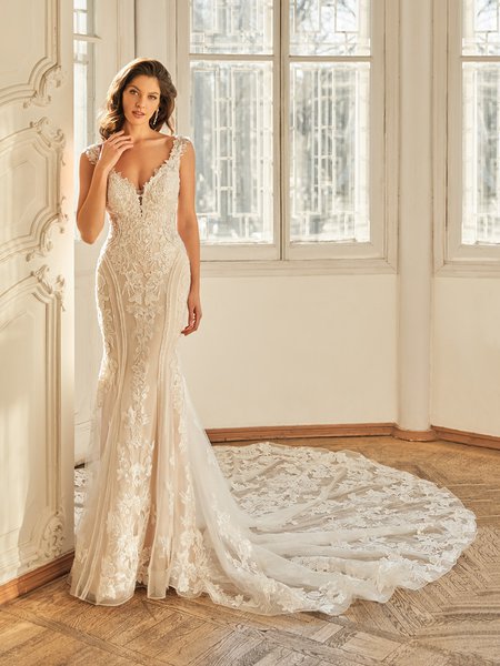 Moonlight Couture H1507 romantic lace wedding dresses with sleeves and beading make a statement.
