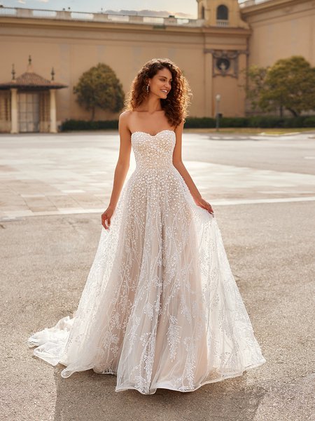 Moonlight Couture H1524 romantic lace wedding dresses with sleeves and beading make a statement.
