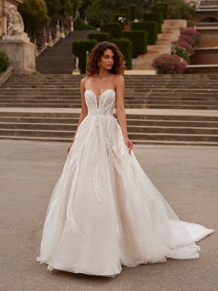 Moonlight Couture H1530 romantic lace wedding dresses with sleeves and beading make a statement.