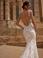 Bride Wearing Illusion Low Back Wedding Dress With 3D Floral Lace and Lace Straps