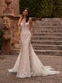 Moonlight Couture H1566A romantic lace wedding dresses with sleeves and beading make a statement.