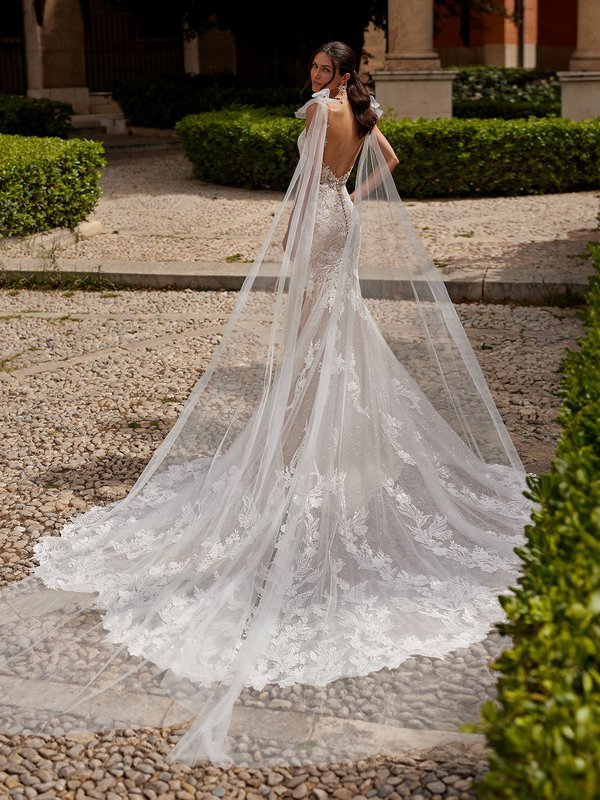 Back View Of Bride In Fitted Wedding Dress With Semi-Cathedral Train and Low V-Shaped Back