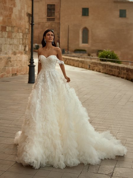 Moonlight Couture H1570 romantic lace wedding dresses with sleeves and beading make a statement.