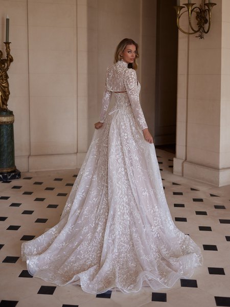 Stunning back of a luxurious wedding dress adorned with leaf lace, an illusion lace-up, and a graceful chapel train Moonlight Couture H1605 Stunning back of a luxurious wedding dress adorned with leaf lace, an illusion lace-up, and a graceful chapel train Moonlight Couture H1605