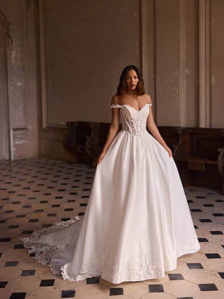 Moonlight Couture H1646 romantic lace wedding dresses with sleeves and beading make a statement.