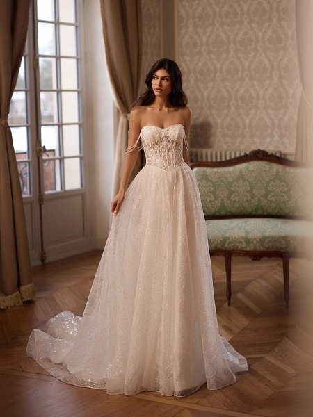 Moonlight Couture H1652 romantic lace wedding dresses with sleeves and beading make a statement.