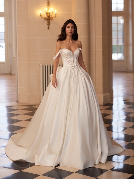 Moonlight Couture H1655 romantic lace wedding dresses with sleeves and beading make a statement.