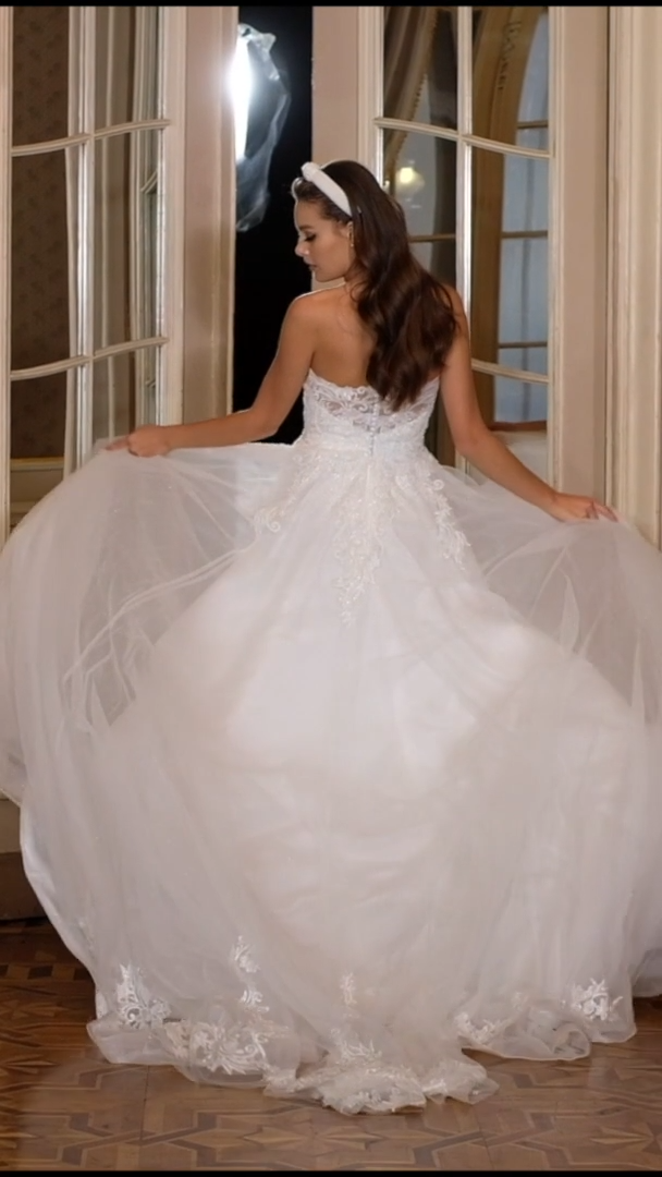 Moonlight Collection J6827 Sparkly Strapless Pointed Bust Full A-Line Wedding Dress With Lace Appliques And Long Sheer Train Moonlight Collection J6827 Sparkly Strapless Pointed Bust Full A-Line Wedding Dress With Lace Appliques And Long Sheer Train