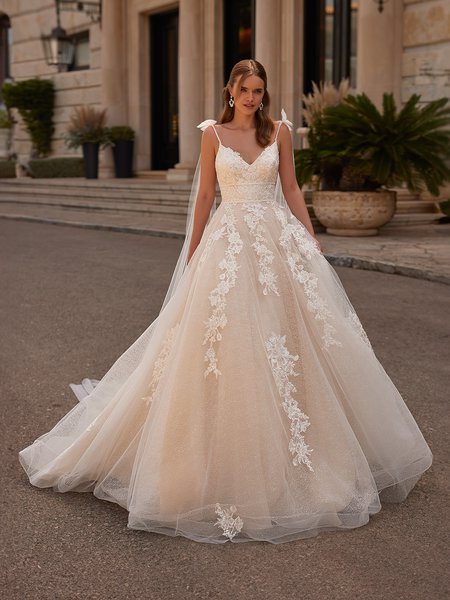Bride In Champagne Colored Wedding Dress With Double Beaded Bands at Waistline and Bows At Shoulders Bride In Champagne Colored Wedding Dress With Double Beaded Bands at Waistline and Bows At Shoulders