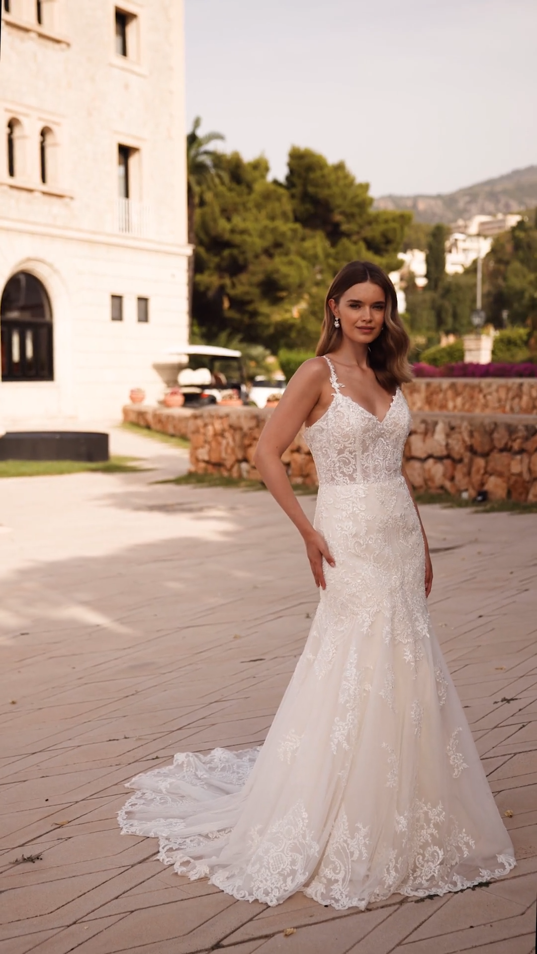 Bride Standing In Mermaid Lace Wedding Dress With Beaded Lace Spaghetti Straps