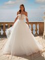 Bride Outside Wearing Beaded Lace Ball Gown With Straight Neckline and Lace Swag Sleeves