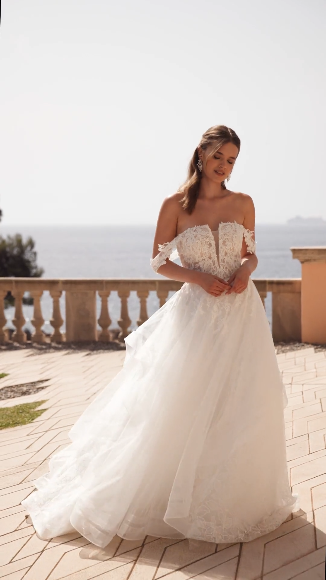 Bride Wearing Straight Neckline Ball Gown With Cascades