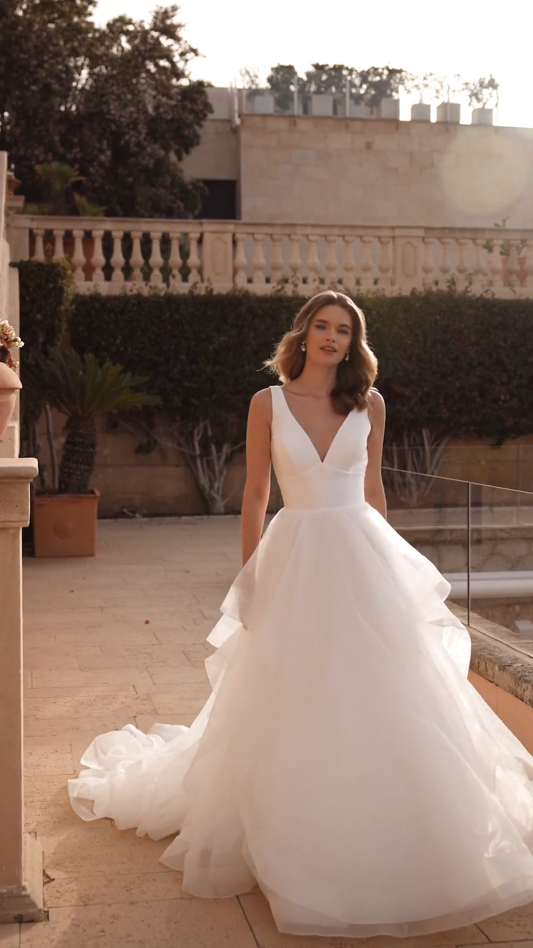 Bride Wearing Mikado Bodice A-line Wedding Dress With Organza Cascade Skirt