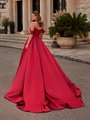 Back view of bride wearing A-line red satin wedding dress with buttons along the back to the end of the train