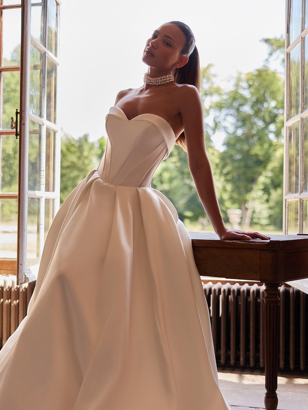 Moonlight Collection J6997 Strapless folded neckline drop waist mikado A-line with illusion side cutouts and pockets