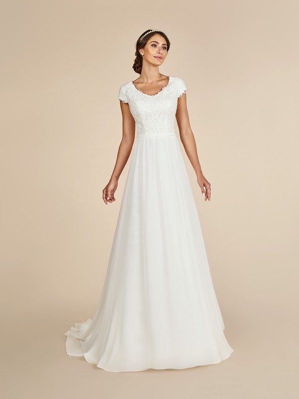 Elegant A-line dress with wide v-neck, lined cap sleeves, re-embroidered lace appliques and couture band at waist Elegant A-line dress with wide v-neck, lined cap sleeves, re-embroidered lace appliques and couture band at waist