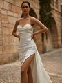 Close up view of bride wearing strapless sweetheart crepe wedding dress with side leg slit
