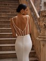 Close up back view of modern crepe wedding dress with corset v shaped back