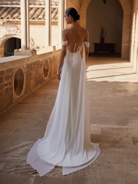 A crepe mermaid wedding dress with illusion scoop back with beaded lace and chiffon off the shoulder tails
