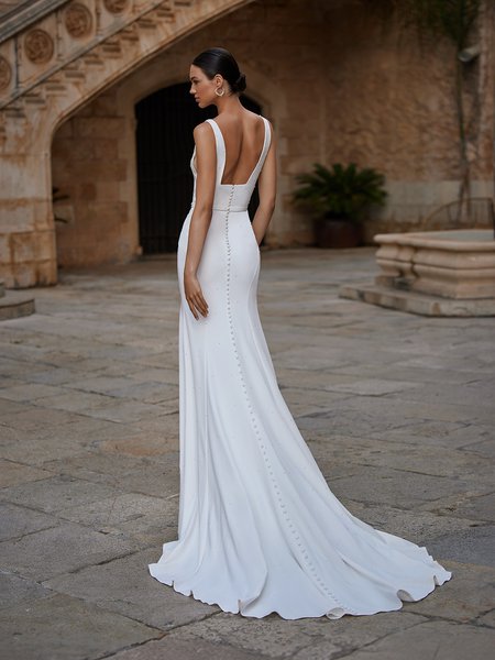 Deep v-neckline crepe mermaid wedding dress with scattered pearls