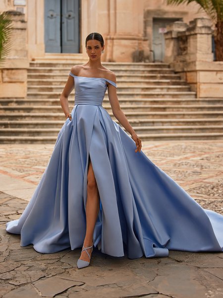 Bride walking in off the shoulder light blue wedding dress with leg slit