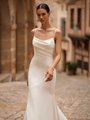 Soft scoop neckline crepe wedding dress with draped bodice and spaghetti straps