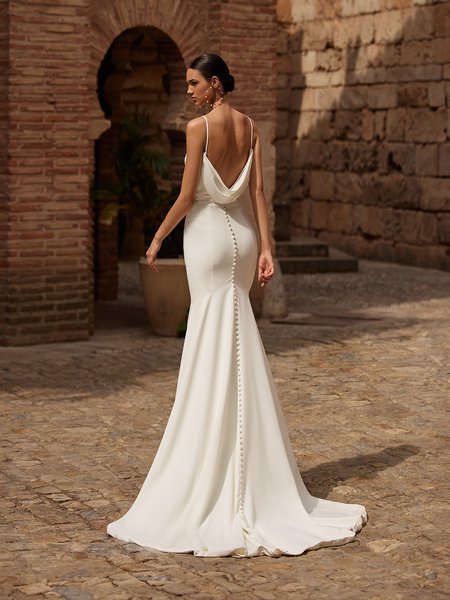 Cowl back mermaid crepe wedding dress with buttons along the zipper to end of train